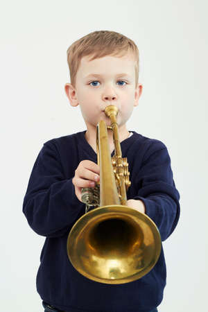 little boy playing trumpet.music child.musical instrumentの写真素材