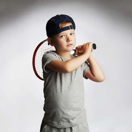 Little Boy Playing Tennis. Sport kids.Child with Tennis Racket.healthy children