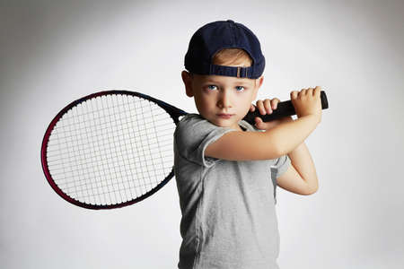 Little Boy Playing Tennis. Sport kids.Child with Tennis Racket.healthy childrenの写真素材