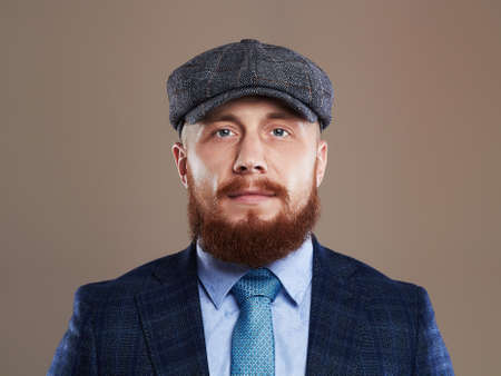 bearded man in hat.Hipster boy.handsome Brutal man with red beardの写真素材