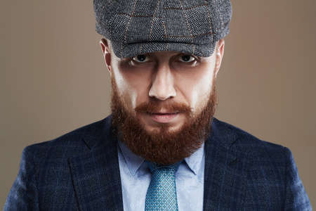 bearded man in hat.Hipster boy.handsome Brutal man with red beardの写真素材