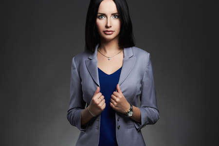 fashion business woman in a suit.elegantly dressed young brunette lady