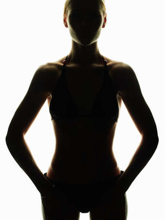 female silhouette on white.girl with a sports body.dietの写真素材