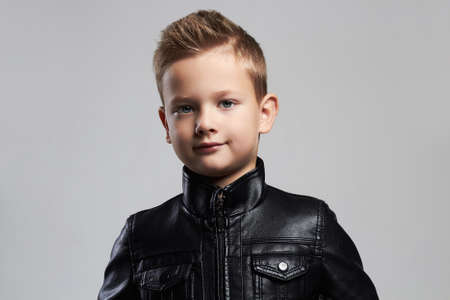 Fashionable child in leather coat.stylish little boyの写真素材