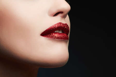 Beauty Model Woman.Beautiful Red Lips.Gorgeous Glamor Lady Portrait.Makeup Detail.glitter lipsの写真素材