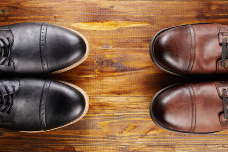 classic and casual pair of men's shoes on wooden background.fashion men boots still lifeの写真素材