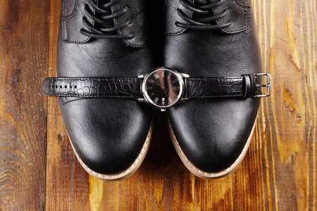 classic men's shoes and watches.fashion businessman still life on wooden tableの写真素材