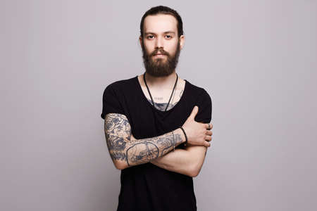 handsome bearded man.Brutal hipster boy with tattoo