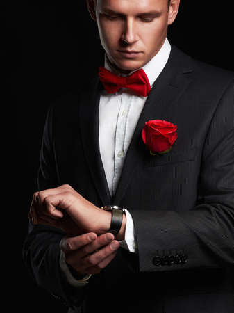 man with flower.young groom man in suit.elegant boyの写真素材