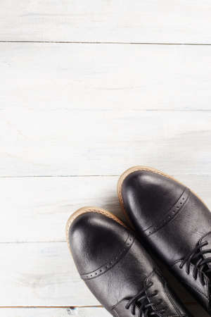 classic men's shoes.fashion still life men boots on wood backgroundの写真素材
