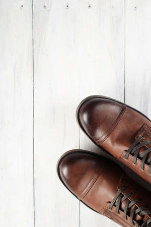 fashion men's shoes on wooden table. man bootsの写真素材