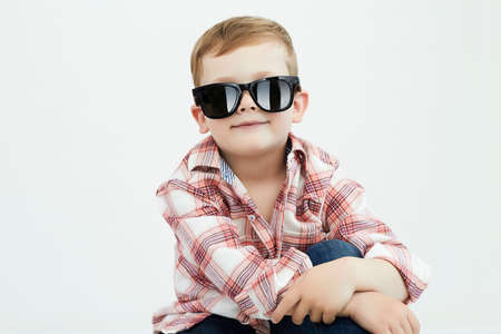 smiling child boy in sunglasses. handsome funny kid close-up portraitの写真素材