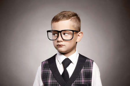 intelligent child in glasses.little boy in suit and glasses.elegant kidの写真素材
