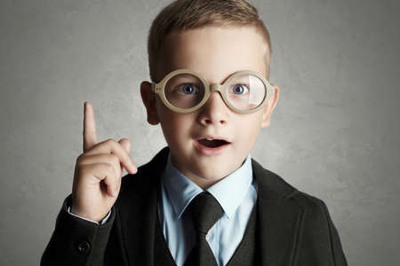 funny child in glasses and siut.genius Kids.school educationの写真素材