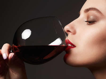 Beautiful woman drinking red wine.beauty girl with wineglass