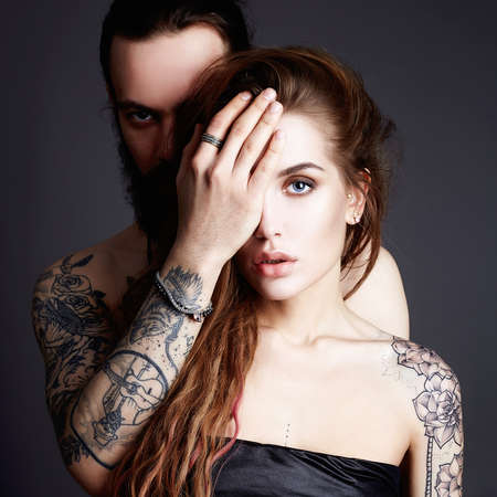beautiful couple with tattoo. beauty woman and handsome man. lovely boy and girl. love