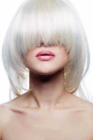 Portrait of Beautiful Girl with Hair on her Face. Young sexy woman in bob Hairsytle wigの写真素材