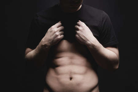 Young Man with Beautiful Body. Boy show his Musclesの写真素材