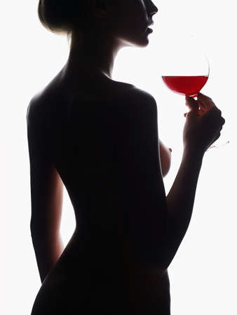 Nude Beautiful Body Woman with Red Wine Glass. Naked Girls back, sexy silhouetteの写真素材