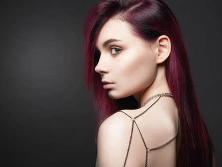 Jewelry on Female Back. Beautiful Girl with color Hair and chain Necklace. sexy Young Woman, Trendy Dyed Hair colorの写真素材