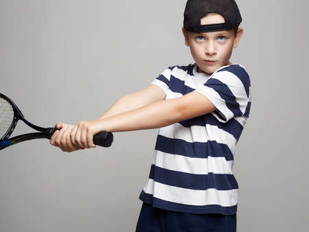 Child Boy Playing Tennis. Sport kids. Little Boy with Tennis Racket