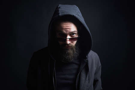Bearded Man in Hood. Boy in glasses under Hood.の写真素材