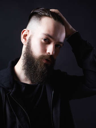 Sexy Boy with stylish haircut. handsome Man, Brutal bearded hipster