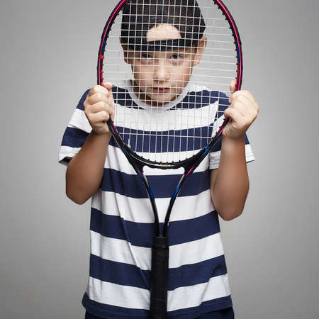 Little Boy Playing Tennis. Sport kids. Child with tennis racquetの写真素材
