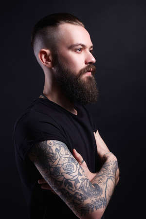 Boy with stylish haircut and tattoo. handsome Man, Tattoed bearded hipsterの写真素材