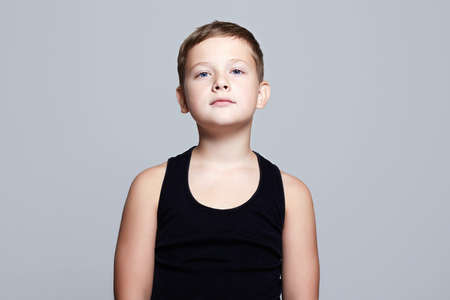 Portrait of Child. Funny Kid with blue eyes. Handsome teen boyの写真素材