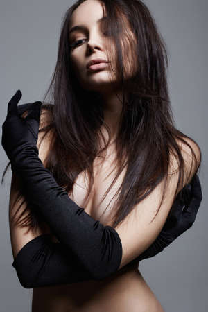 Beautiful Naked Girl in long Gloves. Sexy Beautiful Young Woman with perfect bodyの写真素材
