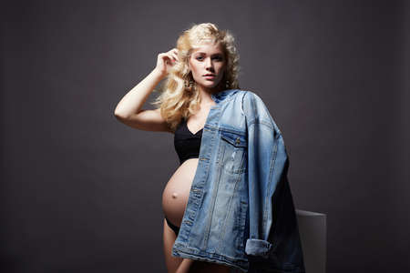 young beautiful pregnant woman. Blonde girl with big belly. Happy pragnancyの写真素材