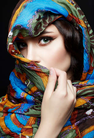 beautiful young woman in color veil. beauty girl in colorful hijab. fashion islamic or indian style woman. ethnic peopleの写真素材