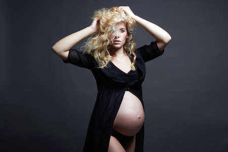 young beautiful pregnant woman. Blonde girl with big belly. Happy pragnancyの写真素材