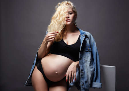 young beautiful pregnant woman. Blonde girl with big belly. Happy pragnancyの写真素材