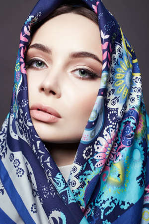 beautiful woman in color flower veil. beauty girl in colorful hijab. fashion Oriental style woman