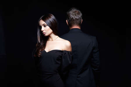 beautiful woman together with a man in a suit. Relationship concept photo. treason
