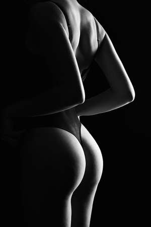 Sexy Back of Woman. Black Sexual lingerie, perfect body Girl. Female booty silhouetteの写真素材