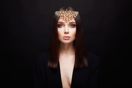 fashion portrait of Beautiful sexy woman in jewelry. jewelry crown on brunette ladyの写真素材