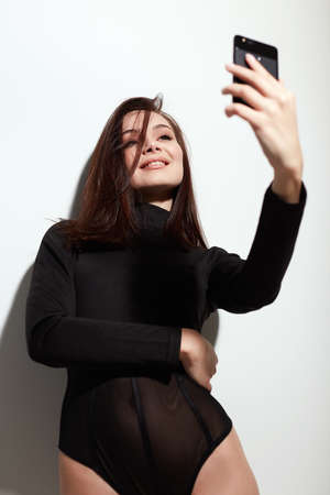 beautiful young smiling woman doing selfie for social networkの写真素材