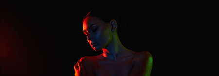 Beautiful young Woman in Colorful bright lights. silhouette of girl