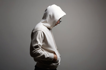 Man in Hood and sunglasses. stylish Boy in a hooded sweatshirt. Male portraitの写真素材