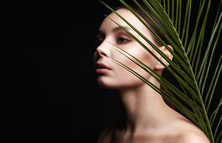 beautiful girl in palms. Beautiful woman with Make-up. Beauty Portrait. wild woman in Jungle.の写真素材