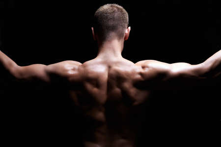 male back. Naked body muscular Man. Sport Gym Concept. Bodybuildingの写真素材