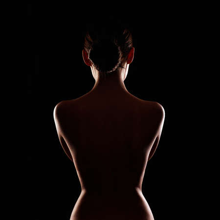 Female Naked silhouette of Woman. Beautiful Sport body girls Backの写真素材