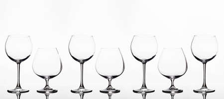 Empty wine glasses on a white background. beautiful still life. Cognac and wineglasses. art posterの写真素材