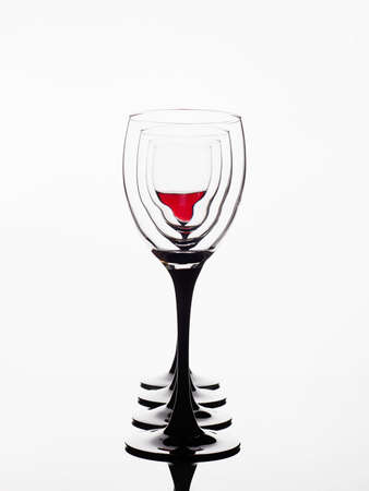 Wineglasses on the mirror. red wine in glass. beautiful still life. Posterの写真素材