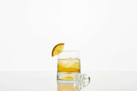 glass with ice and fresh juice. beautiful still life. refreshing cocktail