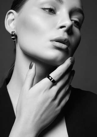 Beautiful young woman with jewelry. pretty girl beauty black and white portraitの写真素材