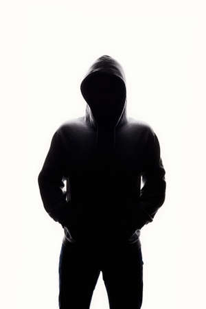 Man in Hood. Boy in a hooded sweatshirt. male silhouetteの写真素材